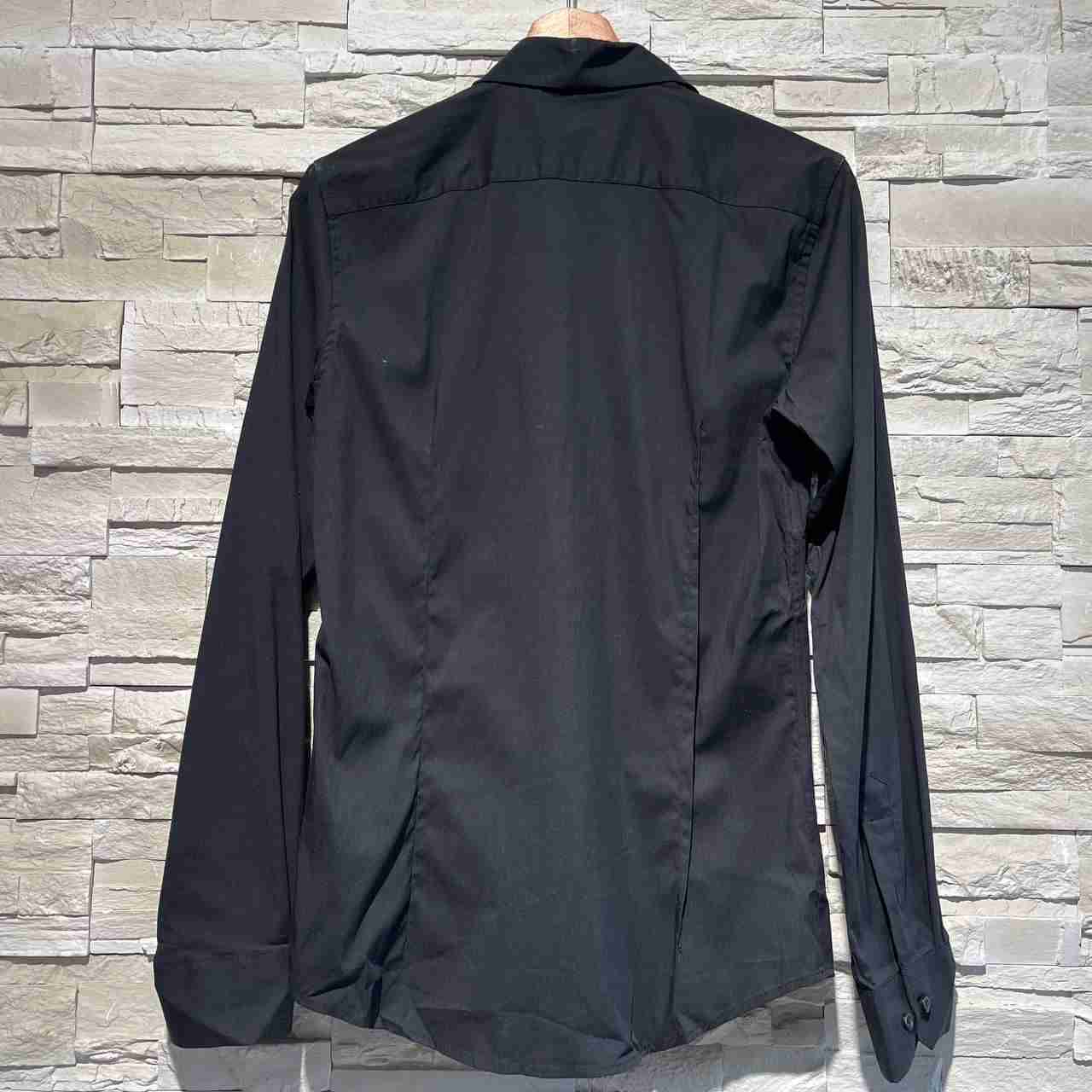 Camicia versa