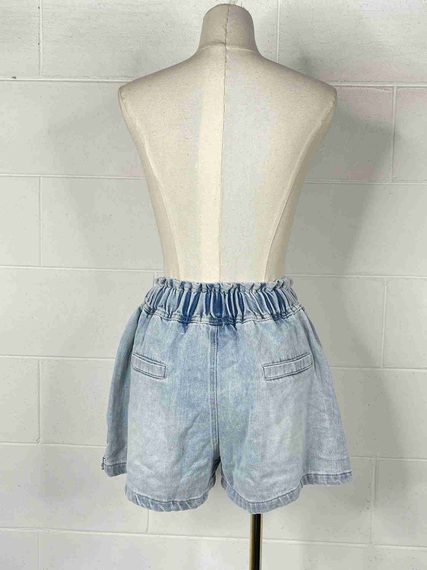 Shorts caramella con diamantini
