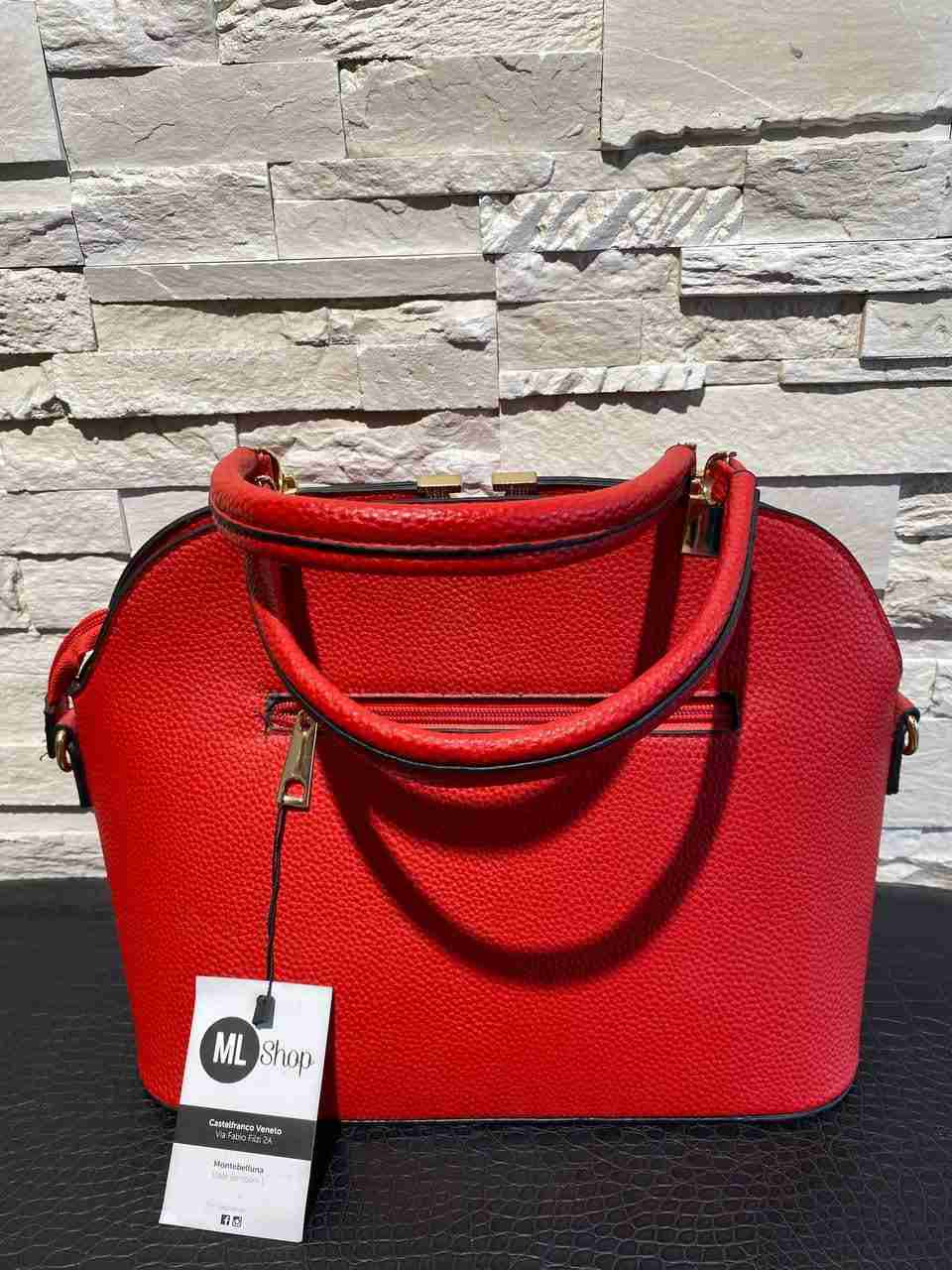 Borsa baule con dettaglio della v in oro
