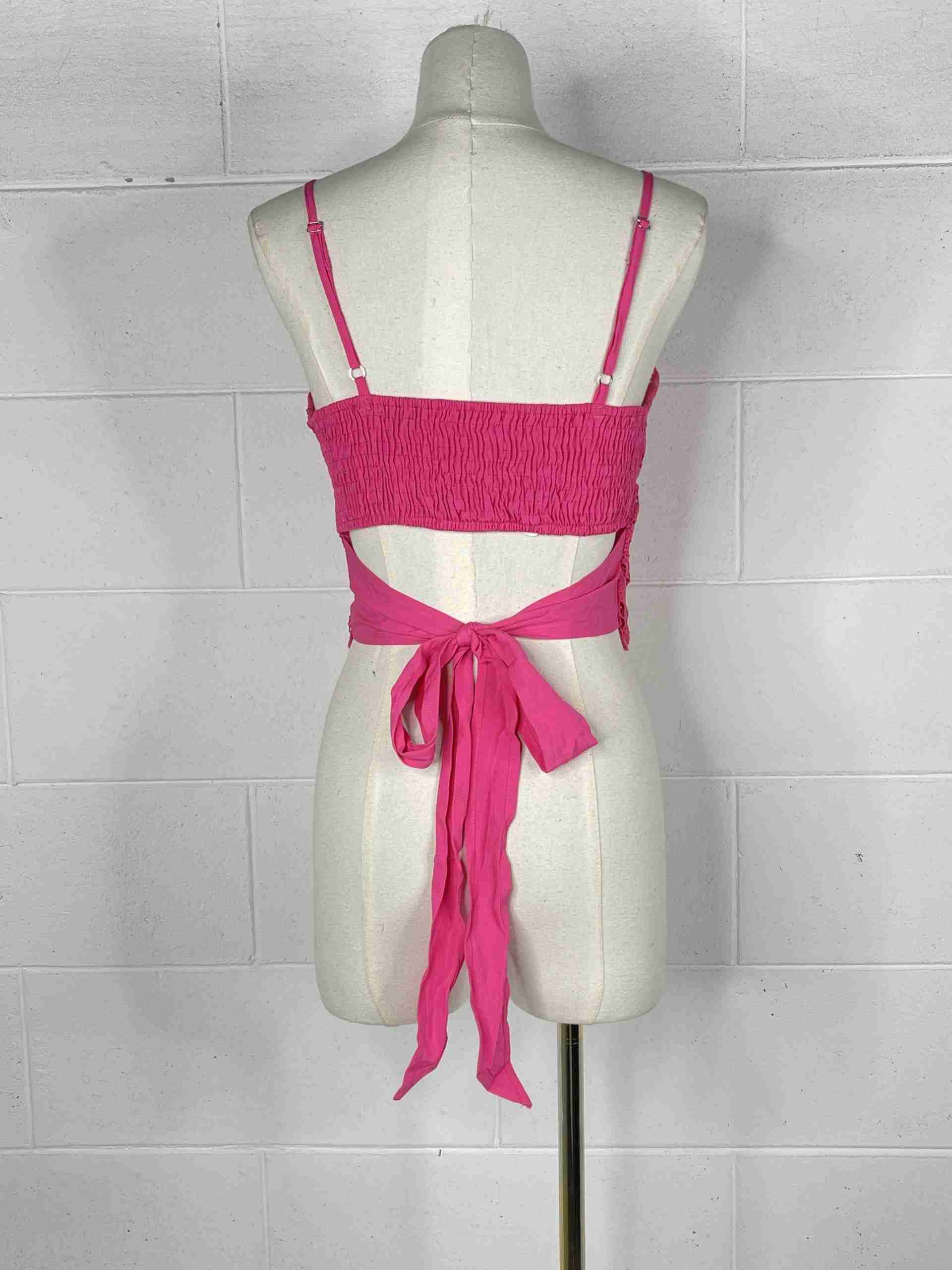 Top in pizzo con fiocco nella schiena