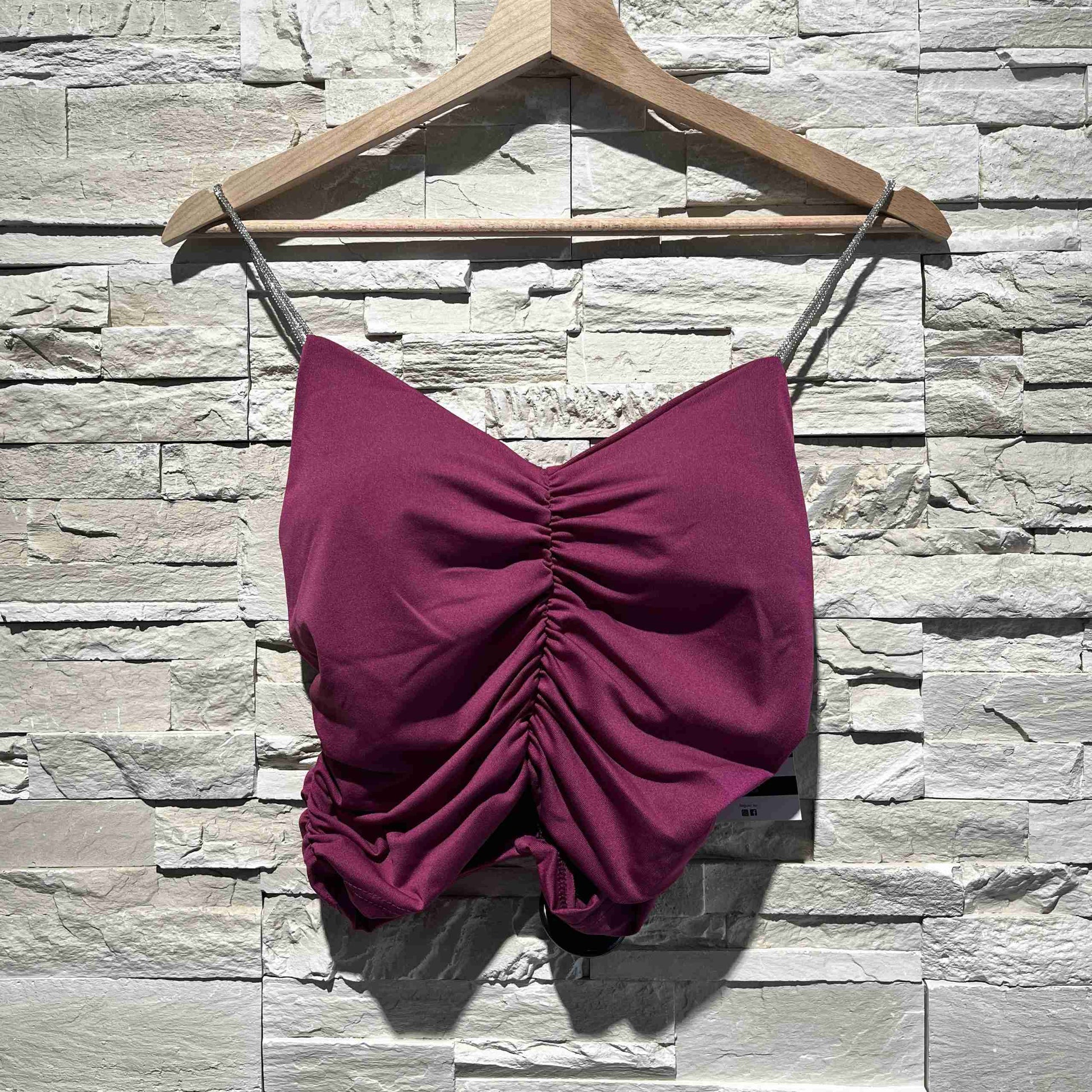 Top arricciato con spalline glitter